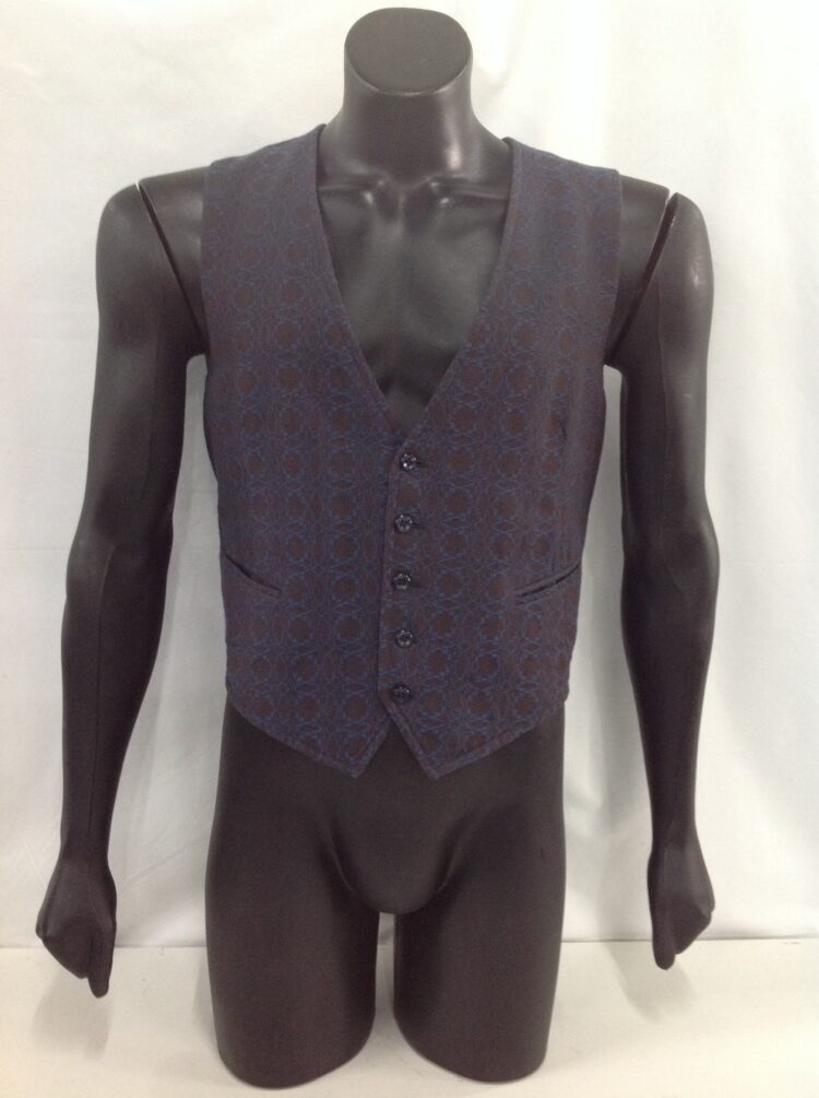 Men's waistcoat for hire. This men's vest a cream and black check brocade pattern on the front with  buttons. Wear this vest with any gangster suit, dress up a regular suit and add a cravat for a Titanic look, or with a cap and braces for a Peaky Blinders look.
