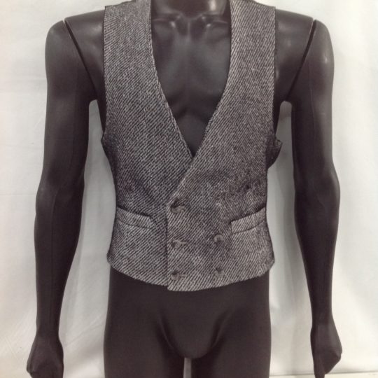 Men's waistcoat for hire. This woolen beige men's vest has 6 buttons on the front.  Wear this vest with any gangster suit, dress up a regular suit and add a cravat for a Titanic look. Also perfect with a cap and braces for a Peaky Blinders look.
